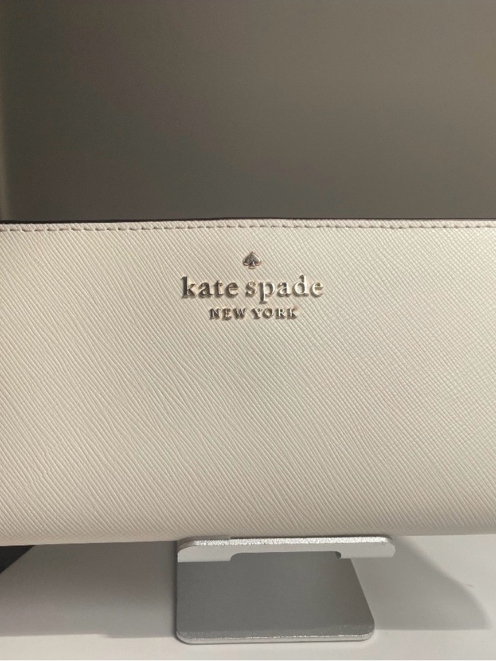 kate spade cream saffiano leather wallet with gold logo